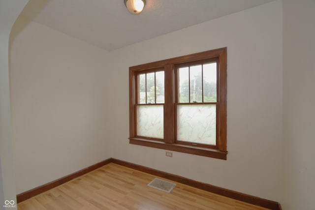 6051 Lowell Ave, Indianapolis, IN 46219 - unfurnished room with baseboards and light wood-type flooring