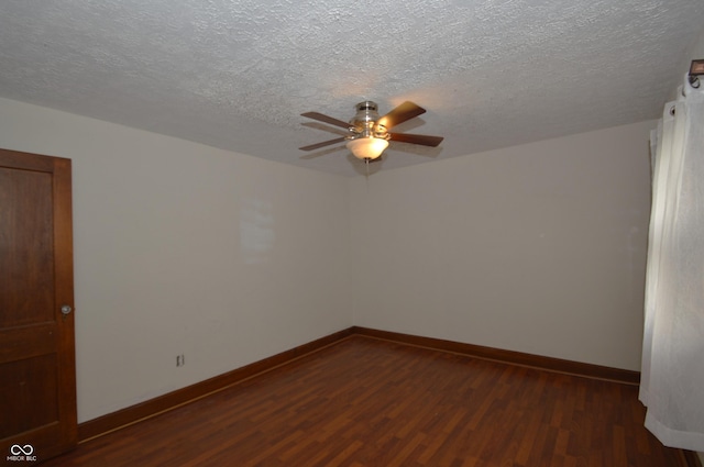 6051 Lowell Ave, Indianapolis, IN 46219 - empty room featuring dark wood-type flooring, ceiling fan, and a textured ceiling