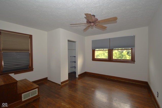 6051 Lowell Ave, Indianapolis, IN 46219 - unfurnished bedroom with wood-type flooring, a textured ceiling, and ceiling fan