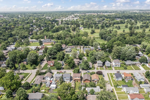 6051 Lowell Ave, Indianapolis, IN 46219 - aerial view of property's location with nearby suburban area and a tree filled landscape