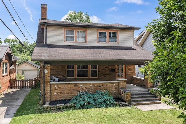 6051 Lowell Ave, Indianapolis, IN 46219 - view of front of house with brick siding, an outbuilding, a chimney, and a detached garage