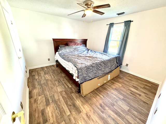 4223 Kestrel Ct, Indianapolis, IN 46254 - bedroom featuring baseboards, a textured ceiling, ceiling fan, and wood finished floors