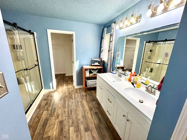 4223 Kestrel Ct, Indianapolis, IN 46254 - bathroom with wood finished floors, a sink, and a stall shower