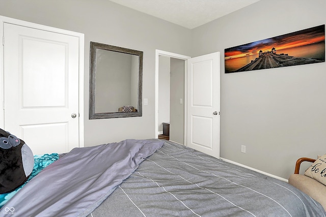 bedroom featuring carpet floors and baseboards