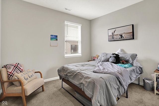 bedroom featuring baseboards, carpet, and visible vents