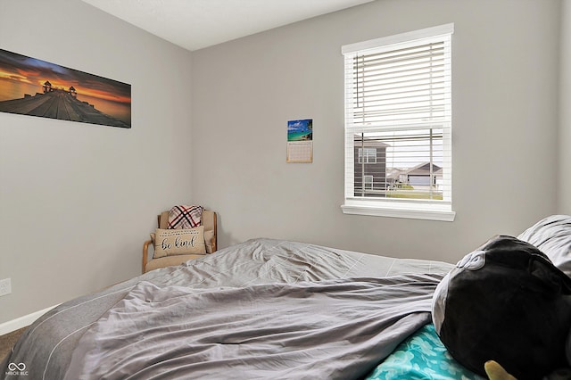 bedroom featuring baseboards