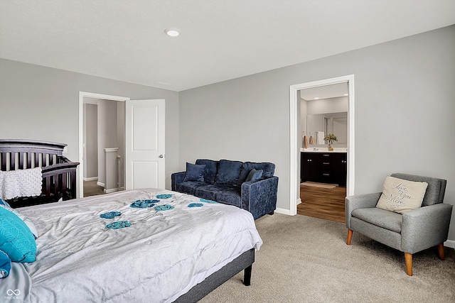 bedroom featuring baseboards and light carpet