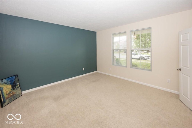2006 Creek Bank Dr, Columbus, IN 47201 - spare room featuring carpet flooring and baseboards