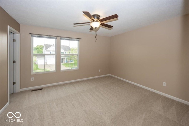 2006 Creek Bank Dr, Columbus, IN 47201 - empty room with ceiling fan, baseboards, and light carpet