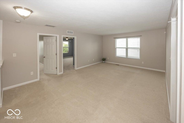 2006 Creek Bank Dr, Columbus, IN 47201 - unfurnished room with baseboards, light colored carpet, and a smoke detector