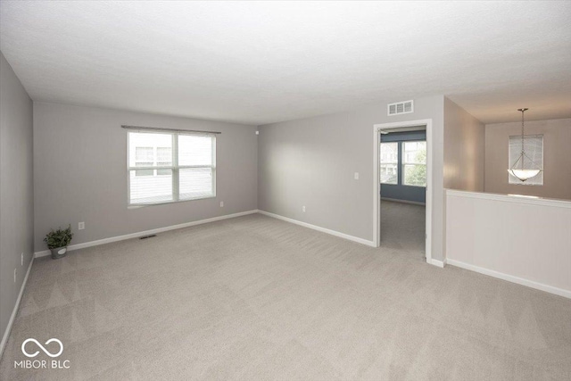 2006 Creek Bank Dr, Columbus, IN 47201 - spare room featuring light colored carpet and baseboards
