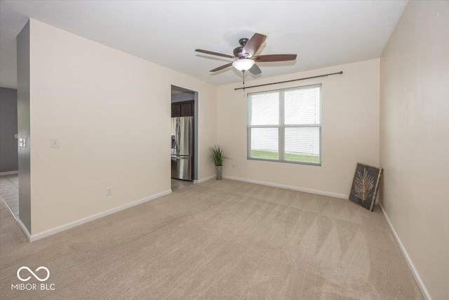 2006 Creek Bank Dr, Columbus, IN 47201 - empty room with light carpet, baseboards, and a ceiling fan