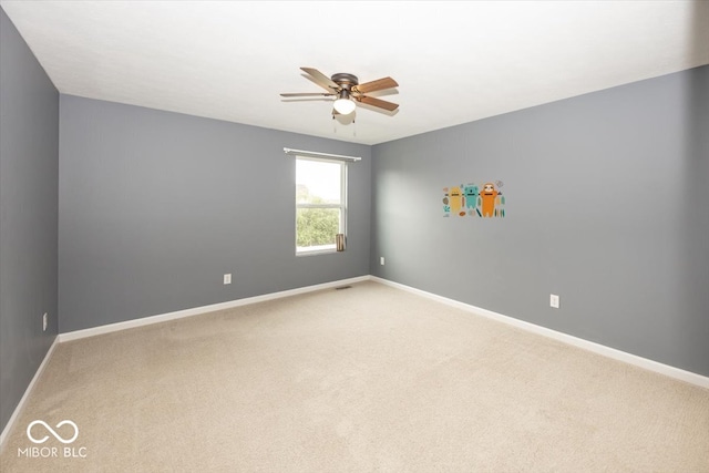 2006 Creek Bank Dr, Columbus, IN 47201 - unfurnished room with a ceiling fan, light carpet, and baseboards