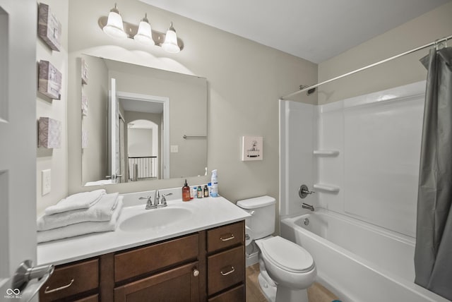full bath featuring vanity, shower / tub combo with curtain, and toilet