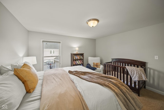 bedroom with carpet floors and baseboards