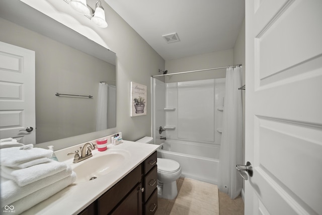 full bath with visible vents, vanity, shower / bath combination with curtain, toilet, and tile patterned floors