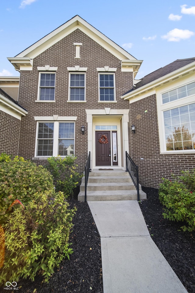 view of front of house featuring brick siding