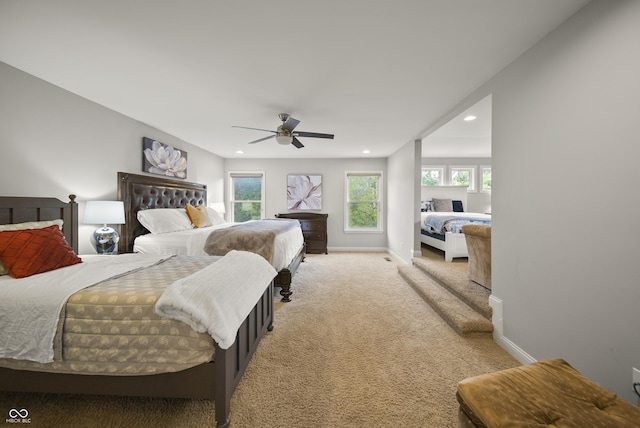 bedroom with recessed lighting, a ceiling fan, light colored carpet, and baseboards