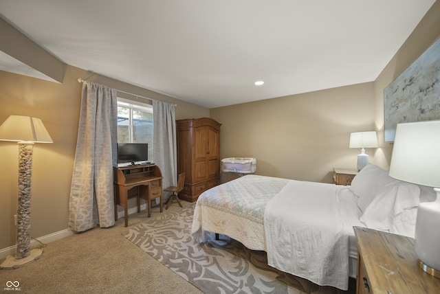 carpeted bedroom featuring baseboards and recessed lighting