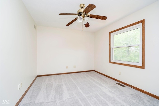 403 Hawthorn Dr, Crawfordsville, IN 47933 - unfurnished room with visible vents, a ceiling fan, baseboards, and light carpet