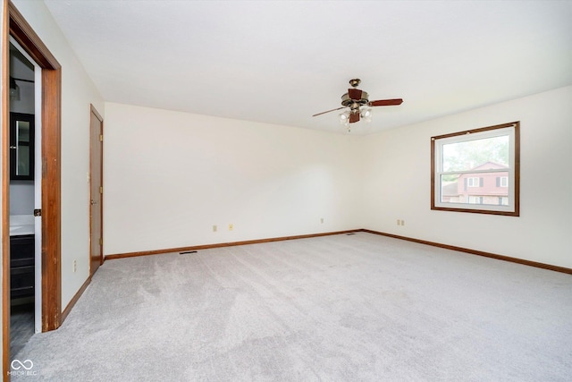 403 Hawthorn Dr, Crawfordsville, IN 47933 - spare room featuring carpet floors, baseboards, and a ceiling fan