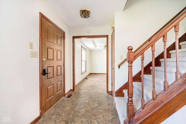 403 Hawthorn Dr, Crawfordsville, IN 47933 - corridor featuring baseboards, stone finish flooring, stairs, and visible vents