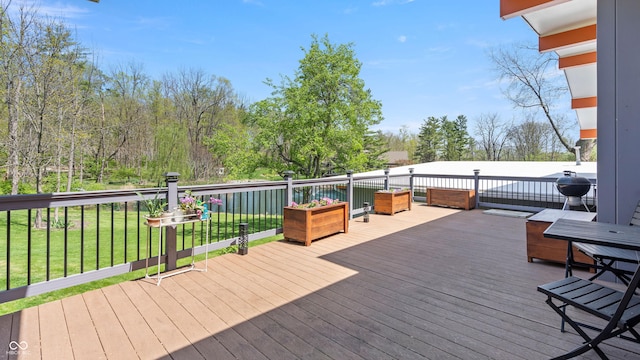 deck featuring a yard