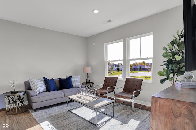 7645 Marin Pkwy, Cumberland, IN 46229 - living area featuring baseboards, wood finished floors, and visible vents