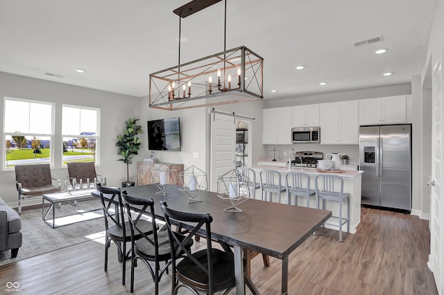 7645 Marin Pkwy, Cumberland, IN 46229 - dining space with recessed lighting, visible vents, and light wood-style floors