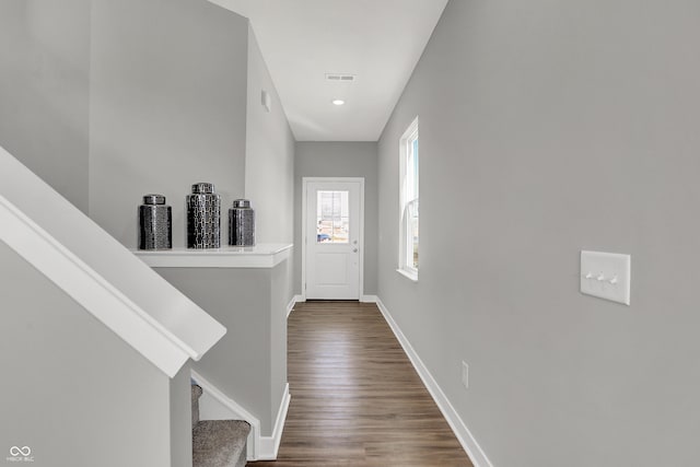 7645 Marin Pkwy, Cumberland, IN 46229 - hallway featuring stairway, baseboards, dark wood finished floors, and visible vents