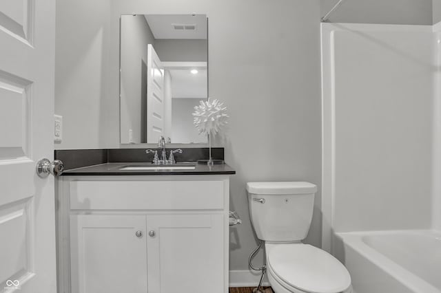 7645 Marin Pkwy, Cumberland, IN 46229 - full bath featuring vanity, toilet, baseboards, tub / shower combination, and visible vents