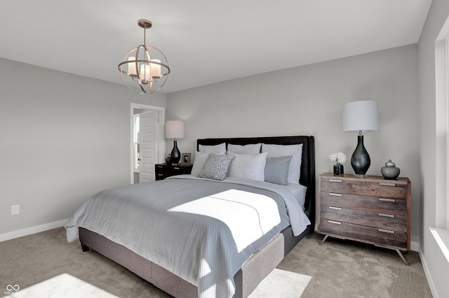 7645 Marin Pkwy, Cumberland, IN 46229 - bedroom featuring baseboards, light colored carpet, and an inviting chandelier