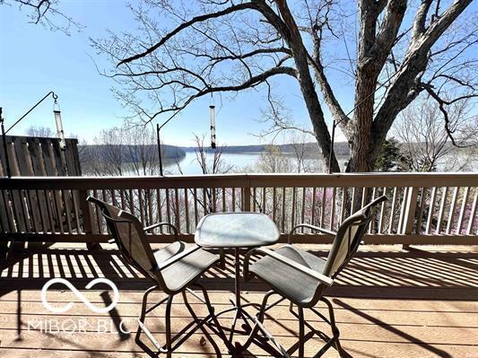 wooden terrace with a water view