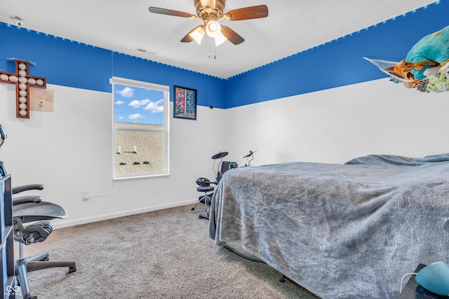 bedroom with a ceiling fan, baseboards, visible vents, and carpet