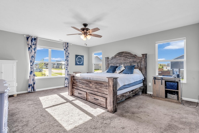 bedroom featuring carpet floors, a ceiling fan, and baseboards
