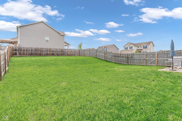 view of yard with a fenced backyard