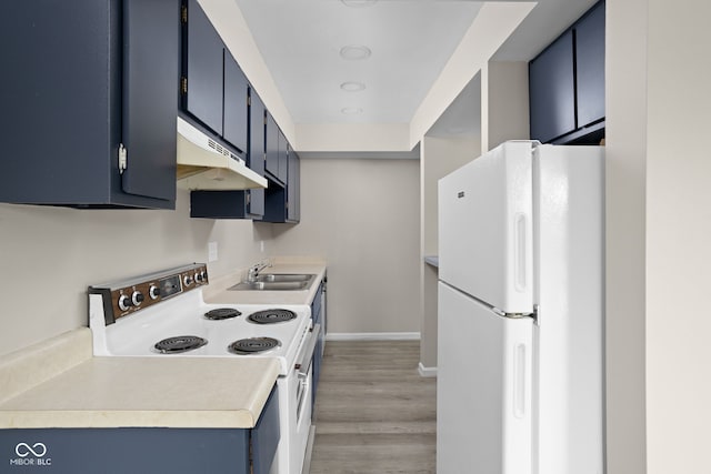 kitchen featuring a sink, white appliances, light countertops, blue cabinetry, and under cabinet range hood