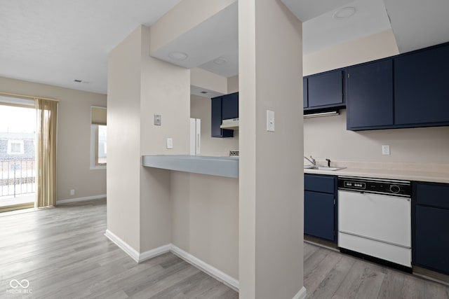 kitchen featuring a sink, light wood-type flooring, blue cabinetry, and dishwasher