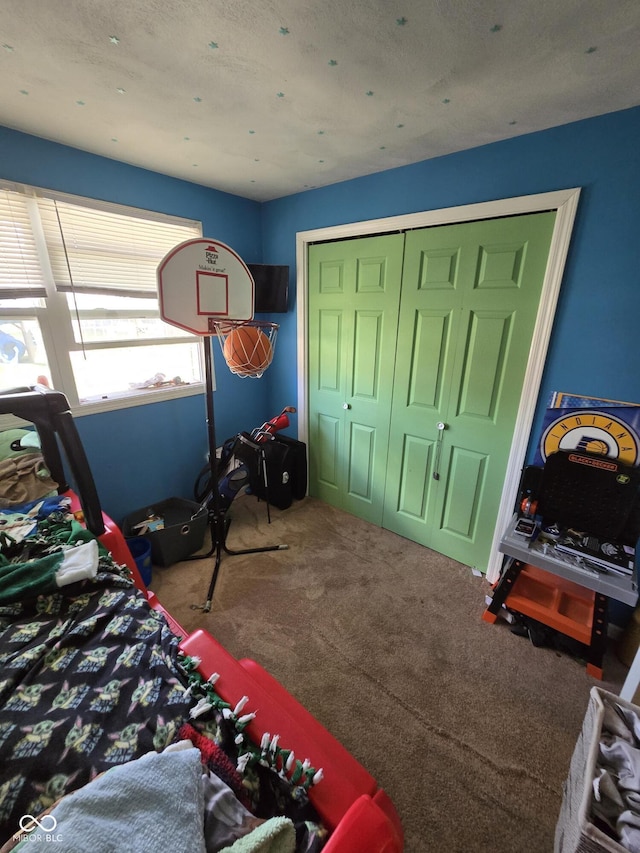 bedroom with carpet floors and a closet