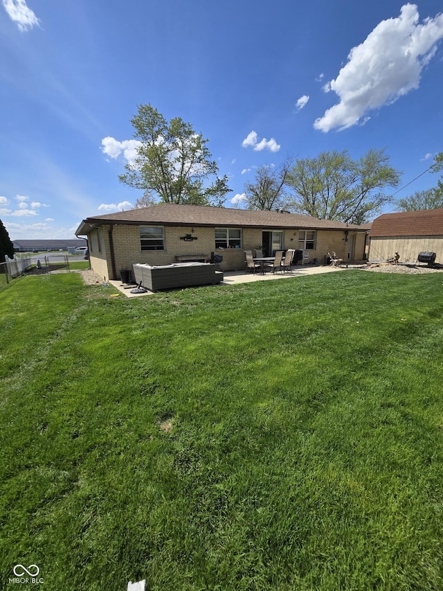 back of house with a lawn, a patio, and fence