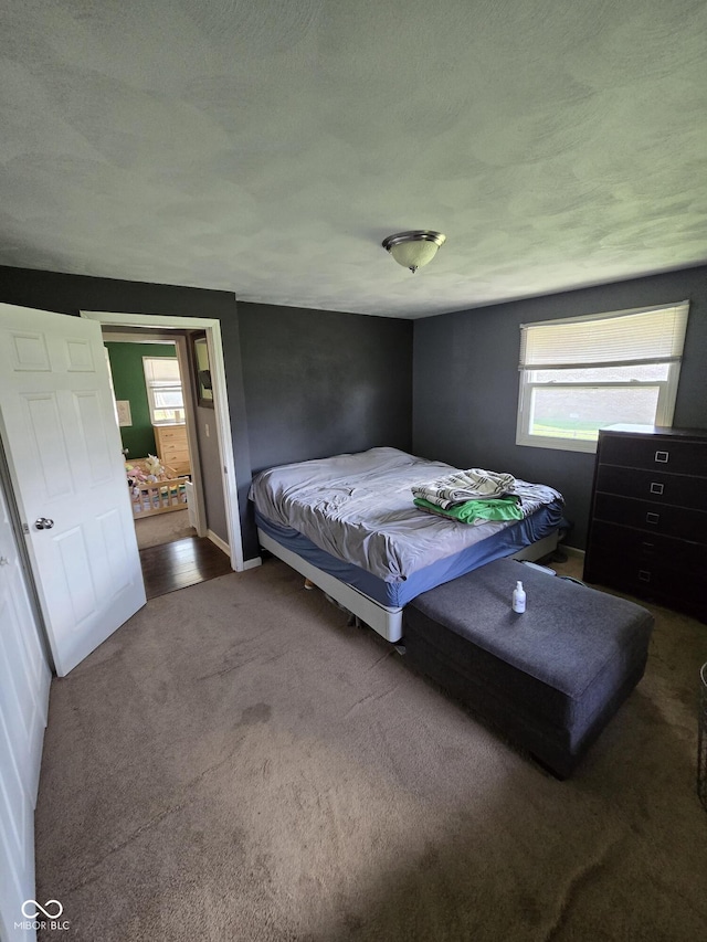 bedroom with carpet floors and baseboards