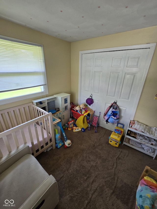 bedroom with carpet floors and a closet