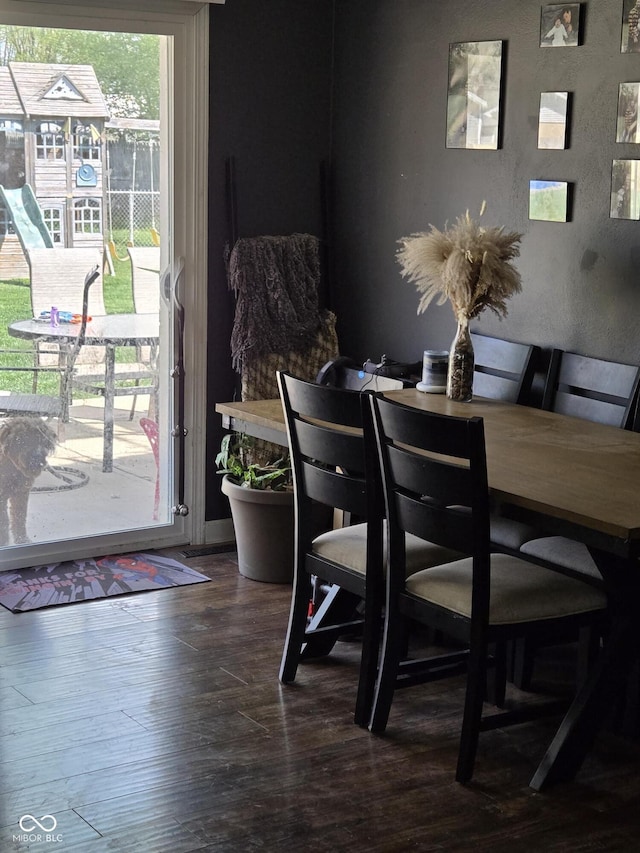 dining area with dark wood finished floors
