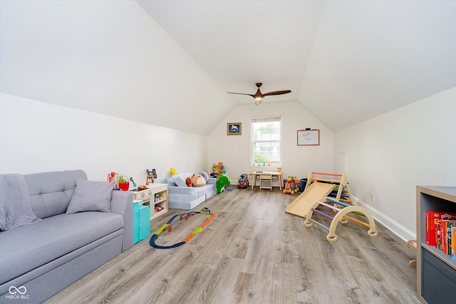 11141 Saybrook Ct, Fishers, IN 46037 - playroom with wood finished floors, lofted ceiling, a ceiling fan, and baseboards