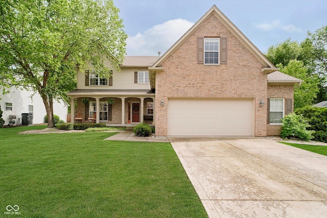 11141 Saybrook Ct, Fishers, IN 46037 - traditional home with brick siding, covered porch, an attached garage, a front lawn, and concrete driveway