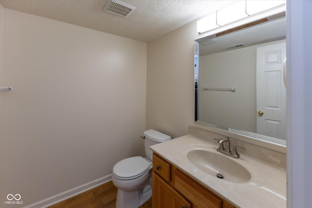 6516 Amherst Way, Zionsville, IN 46077 - half bath with wood finished floors, vanity, and a textured ceiling