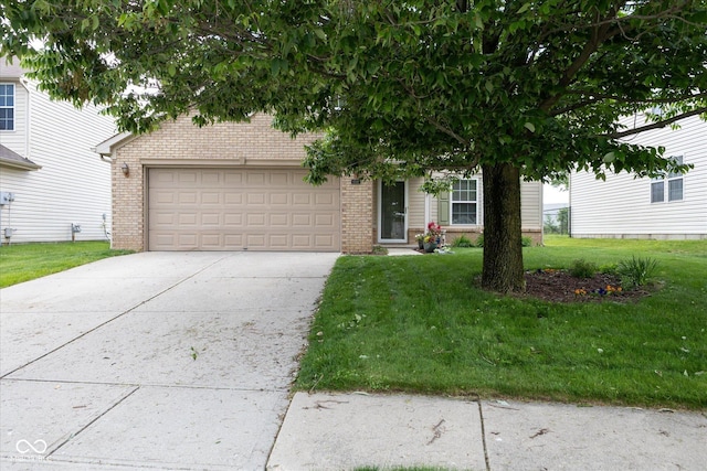 6516 Amherst Way, Zionsville, IN 46077 - view of property hidden behind natural elements featuring brick siding, a front lawn, a garage, and driveway