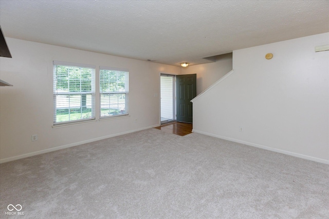 6516 Amherst Way, Zionsville, IN 46077 - spare room with carpet floors and a textured ceiling