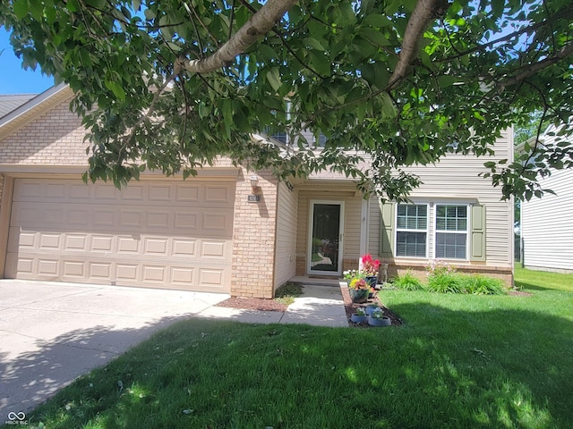 6516 Amherst Way, Zionsville, IN 46077 - obstructed view of property featuring brick siding, an attached garage, a front yard, and driveway