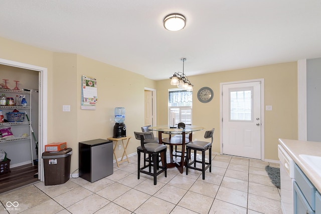 5646 Skipping Stone Dr, Indianapolis, IN 46237 - dining room with light tile patterned floors and baseboards